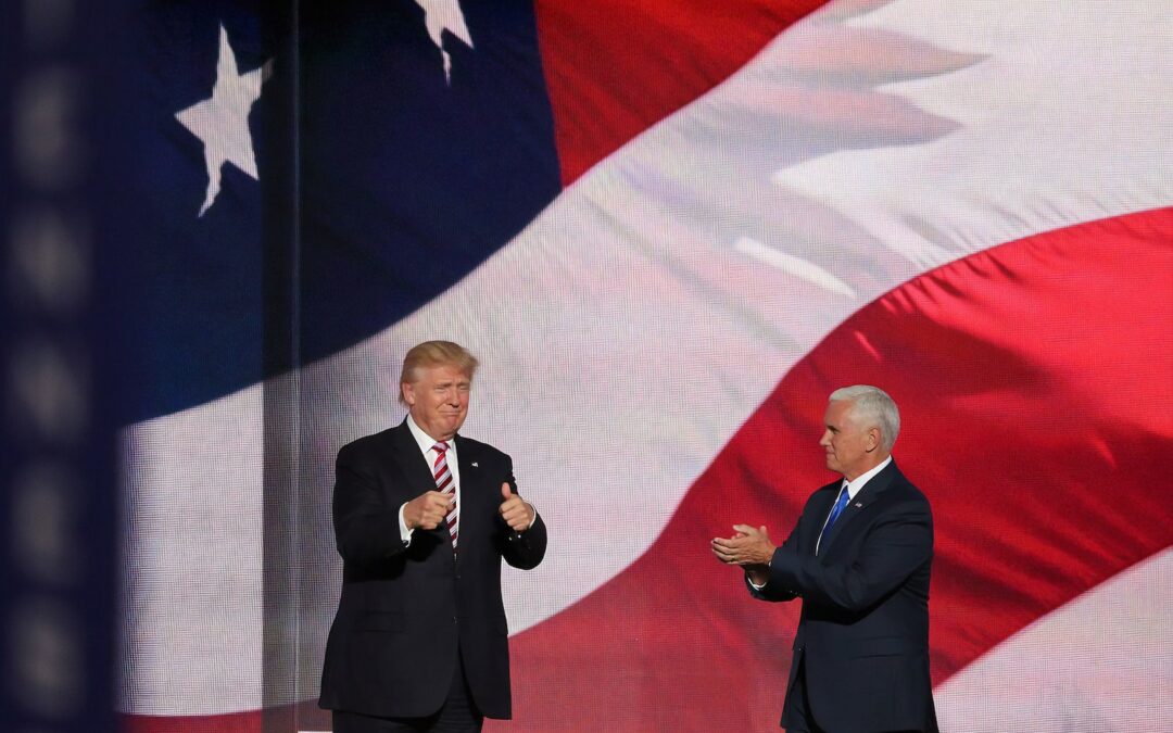 Donald Trump beside man in black suit